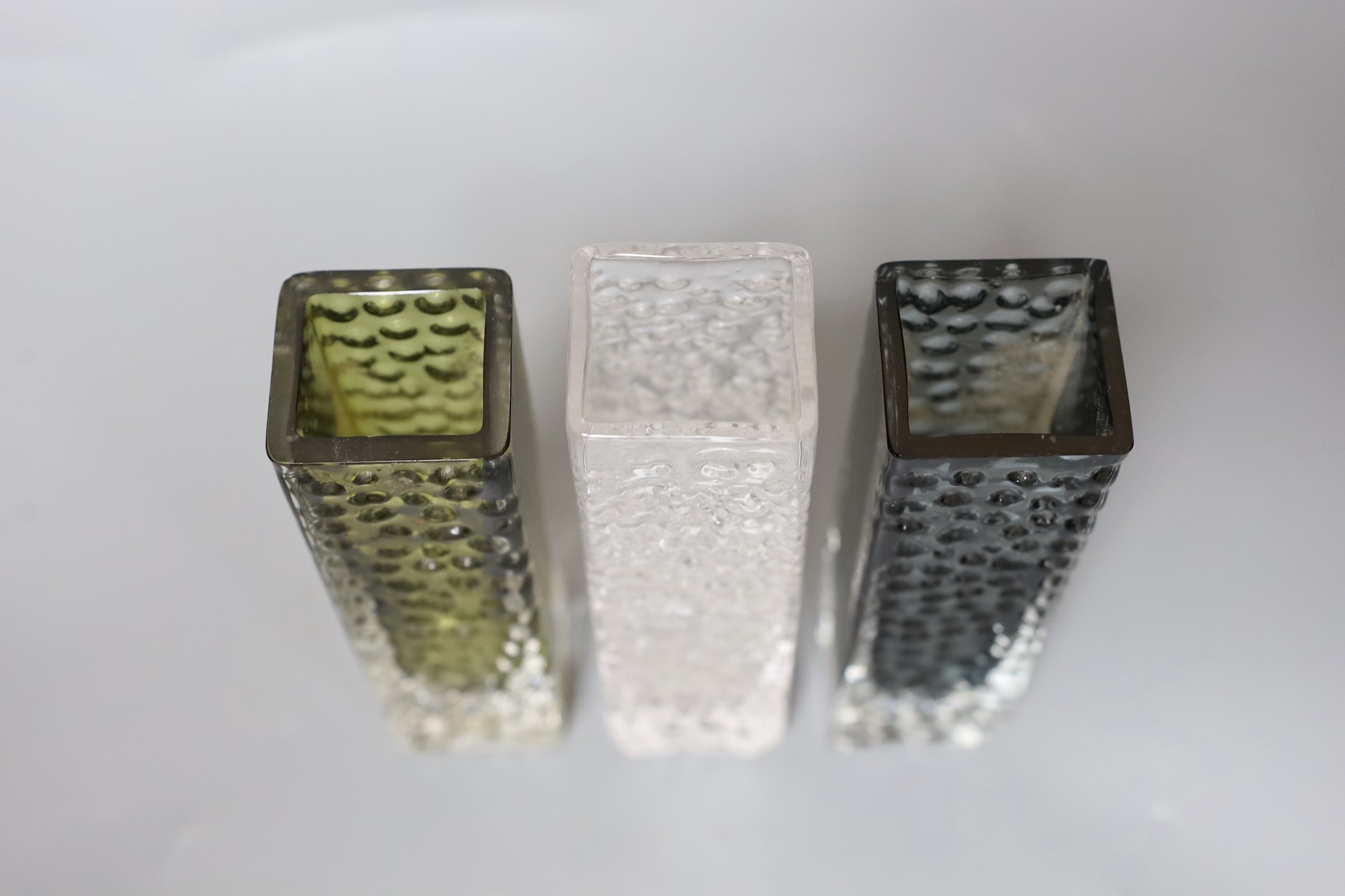 A trio of Whitefriars 'Nailhead' vases, model 9683, designed by Geoffrey Baxter, each 17cm high